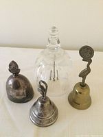 All four decorative bells displayed together showing size and variety.