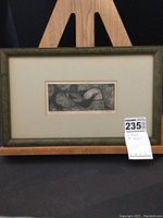 Front view of the framed print 'Mating Season' by Jane Stouffer, showing the entire piece on wooden easel with auction lot tag.