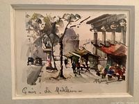 Close view of watercolor painting depicting a street scene with a tree and upper columns, signed Gary, titled 'Paris - La Madeleine'