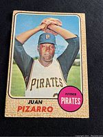 Front of 1968 Topps O-Pee-Chee Juan Pizarro baseball card showing player in pitching pose in Pittsburgh Pirates uniform.