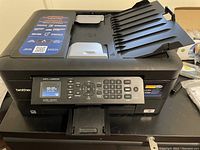 Full view of the Brother MFC-J485DW printer with auto document feeder showing the front and top feeding tray.