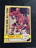 Front of 1972-73 O-Pee-Chee Bobby Hull hockey card showing player in Chicago Black Hawks uniform, labeled NHL All-Star 1971-72.
