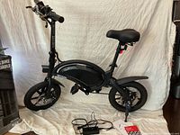 Side view of fully assembled bike on white backdrop