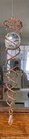 Full view of the copper spiral sun catcher with large clear faceted crystal ball at the top, small clear crystal hanging at the bottom, measures 13 inches long.