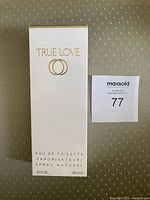 Front view of the True Love Eau de Toilette by Elizabeth Arden box showing branding and volume details (3.3 FL OZ 100 ml).