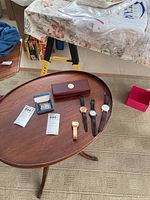 Photo showing all watches and cuff links arranged on a wooden tray and table, illustrating condition and quantity.