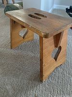 Side view showing heart cutout and handle holes on top