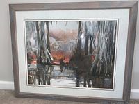 Framed watercolor painting showing the full art and frame, depicting a swamp scene with cypress trees and Spanish moss.