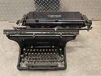 Angled front view showing the entire typewriter body and keyboard layout.