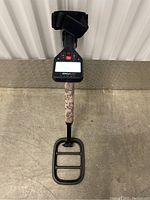 Garrett Go-Find 66 upright view showing control box, camouflage shaft and coil