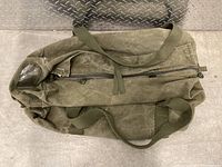 Top view of the duffel bag showing the zipper and carrying handles