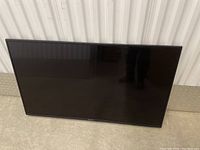 Front view of TV with black bezel and screen off