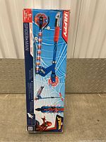 Boxed new kids scooter featuring Marvel Spider-Man graphics, blue color with red accents, packaging shows overall product image and branding.