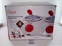 Box image showing the Good Cooking brand, dual chocolate melting pots with red knobs, and mention of 2 cup capacity each.