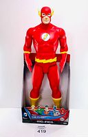 The Flash figure in original packaging showing full front profile and packaging graphics at base.
