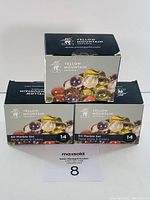 Three boxes of Yellow Mountain Imports 60 marble sets stacked and photographed front-facing. Each box shows clear depiction of marbles and branding.