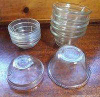 Set of 10 clear mini glass ramekins stacked with two upside down showing embossed bases 'Made in France'