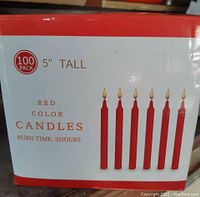 Box label showing 100 pack of 5 inch tall red color candles with burn time 3 hours