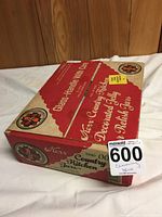 Box showing vintage-style red and beige packaging labeled 'Kerr Country Kitchen Decorated Jelly & Relish Jars' with brand and product line details visible.