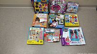Lot of 9 miscellaneous craft sets including candle kit, word beading, lip balm, scrapbook, stepping stones, jewelry loops kit