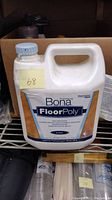 Front view of the Bona FloorPoly container showing label and amount.