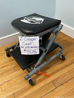 Photo showing side view of the Z Creeper Seat on hardwood floor with a handwritten note indicating the item as 'Z-Creeper Seat for auto mechanics #308'.