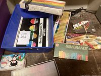 Multiple boxes of artist pastels including Rembrandt and Design Nupastel, plus Berol Prismacolor Art Stix sticks in a blue container