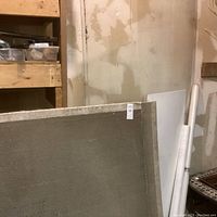 View showing two large gray Edgetech sheets leaning against a wall with label 40 x 48