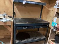 Full front view of the Mastercraft work bench showing main work surface, lower shelf, and drawer.