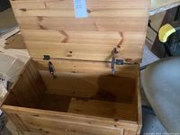 Open cedar chest showing interior and hinges