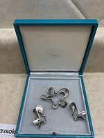 Brooch and clip-on earrings in original presentation box