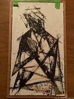 Full view of the unframed abstract painting on paper, secured with green tape at corners.