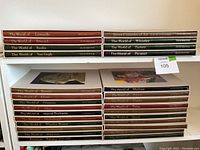 Top shelf showing four brown and green slipcases: Leonardo, Bruegel, Rodin, Van Gogh.