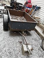 Front view of trailer showing cargo bed, hitch, and frame