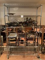 Front view showing full five shelves loaded to illustrate overall condition