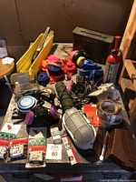 Overview of all tools and repair supplies on table including respirators, tapes, toolbox, and fire extinguisher.