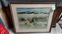 Full view of the framed print showing the winter rural landscape and wooden frame.