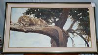 Full view of framed painting showing composition, frame and scene of cougar on branch