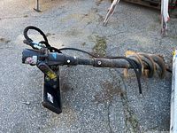 Full view of hydraulic auger assembly laid on pavement
