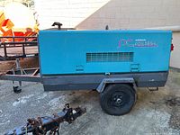 Front-left perspective showing entire compressor unit on trailer
