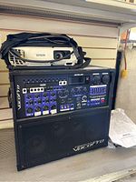 VocoPro Hero-RV PA system with mixer controls, built-in speakers, carrying strap and power cable