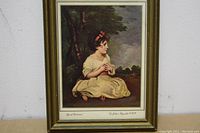 Framed print of 'Age of Innocence' showing full artwork and frame against a white wall.