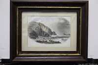Framed antique colored heliogravure coastal bay scene titled 'Mill Bay' showing cliffs, shore, boat and figures.