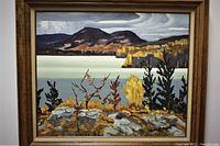 Front view of framed oil painting showing lake, mountains and foliage