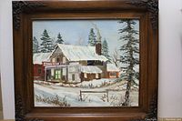 Full view of the oil painting showing snowy winter scene with buildings including antiques and police shop.