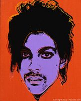 Close-up photo of the framed silkscreen print of Prince in vibrant colors with a red-orange background, purple face, and black detailing, characteristic of Andy Warhol's style.