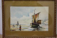 Original watercolor painting in frame showing a shoreline with sailboat and people on beach
