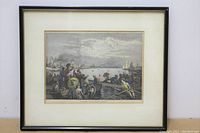 Framed antique colored heliogravure print showing a wide view of Toronto Harbour with various boats and people along the waterfront, in good condition.