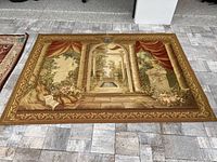 Full view of rectangular woven tapestry on tiled floor