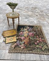 Full overview of tapestry laid flat with accent table, vase, two trays